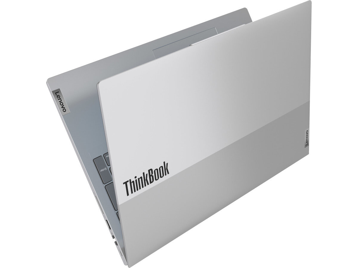 Na obrazie widoczny jest srebrny laptop z częściowo otwartą pokrywą, na której znajduje się napis \'ThinkBook\'. Na krawędzi pokrywy widoczne jest logo \'Lenovo\'.