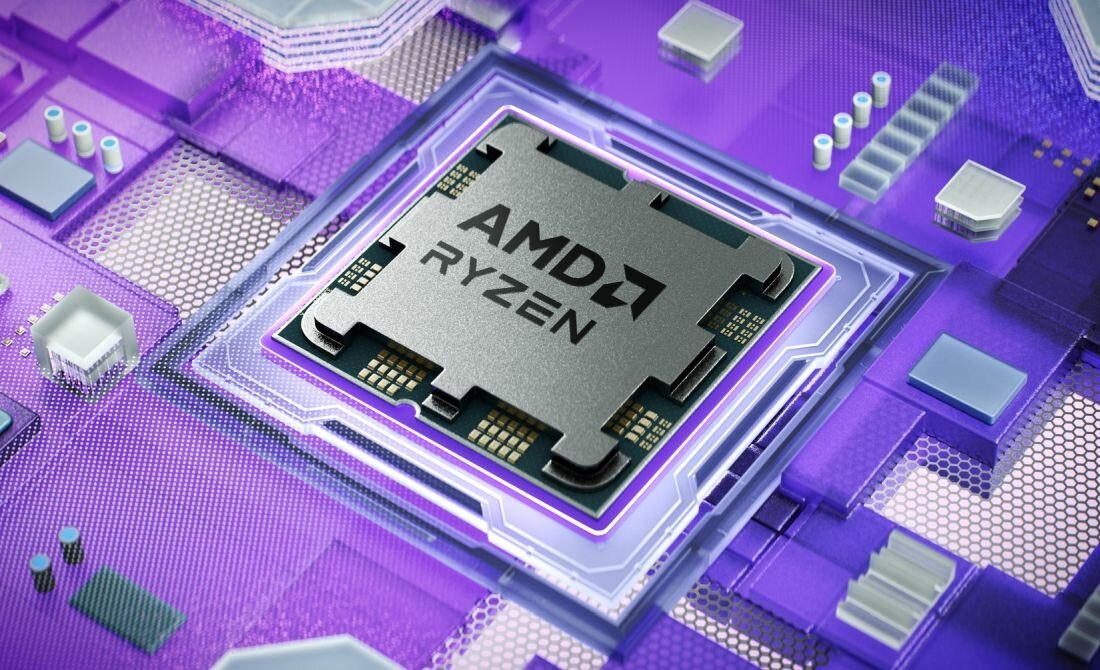 Obraz przedstawia procesor z widocznym logo \'AMD RYZEN\' na tle fioletowej płyty głównej z różnymi elementami elektronicznymi.