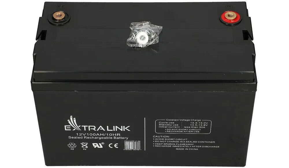 Akumulator EXTRALINK AGM EX.9786 100Ah 12V, wibracje, cykle, obudowa, temperatury, na białym tle akumulator od góry frontem na wprost