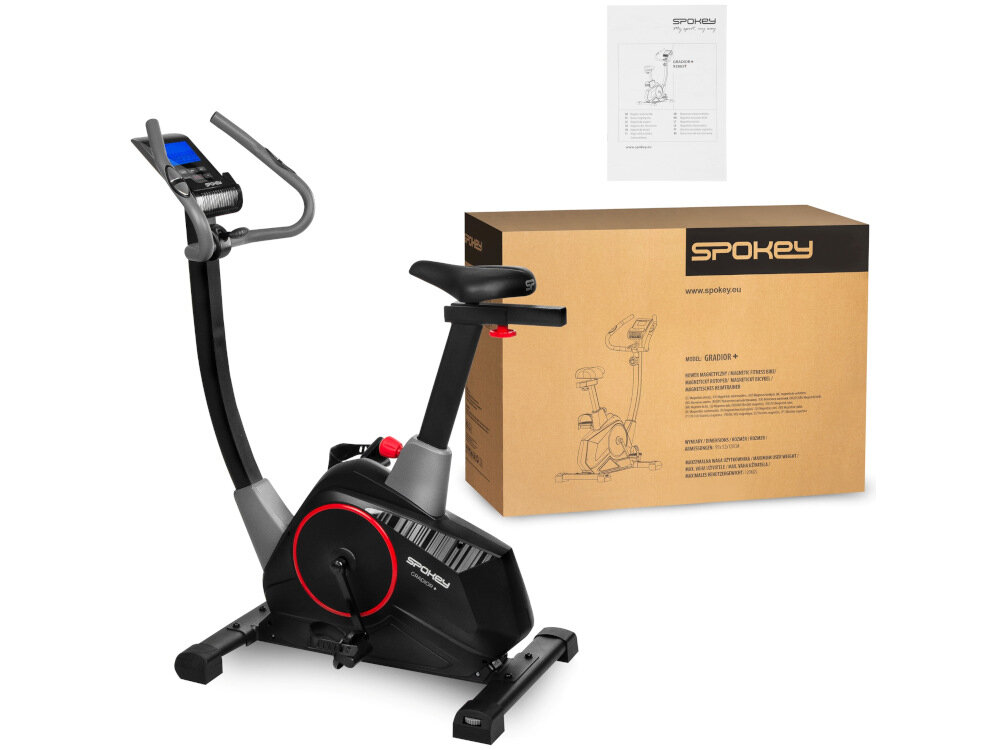 Na obrazie znajduje się czarny rower magnetyczny z czerwonymi akcentami oraz kartonowe pudełko z logo \'SPOKEY\'.