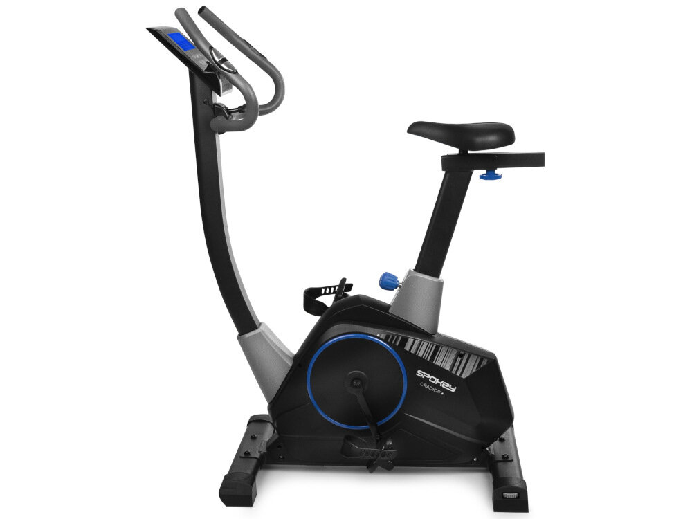 Na obrazie widoczny jest rower magnetyczny z czarną ramą i niebieskimi akcentami. Na obudowie znajduje się napis \'SPOKEY Gradior+\'.