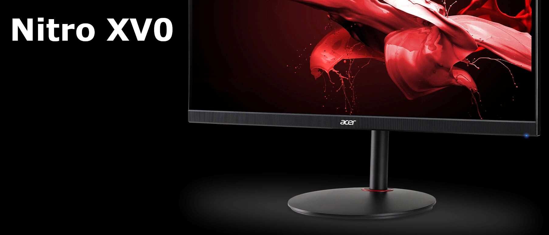 Monitor z logo \'acer\' na podstawce, wyświetlający dynamiczną grafikę w czerwonych odcieniach. Obok monitora widoczny jest napis \'Nitro XV0\'.