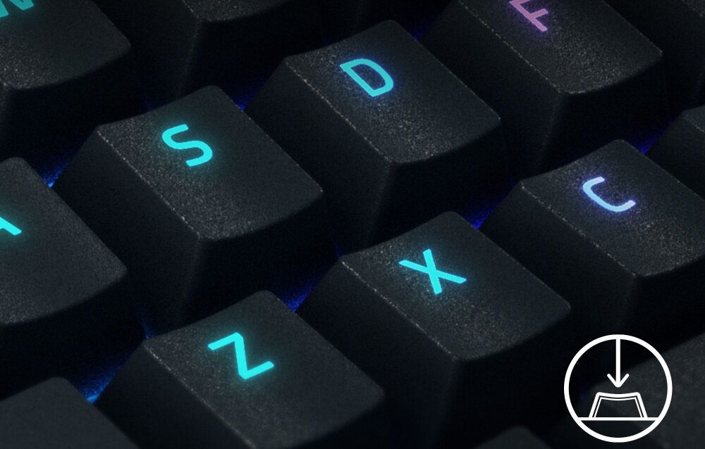 Zbliżenie na klawisze klawiatury z podświetleniem w kolorach niebieskim i fioletowym. Widoczne są klawisze z literami Z, X, C, S, D, F oraz symbol pobierania w okręgu.