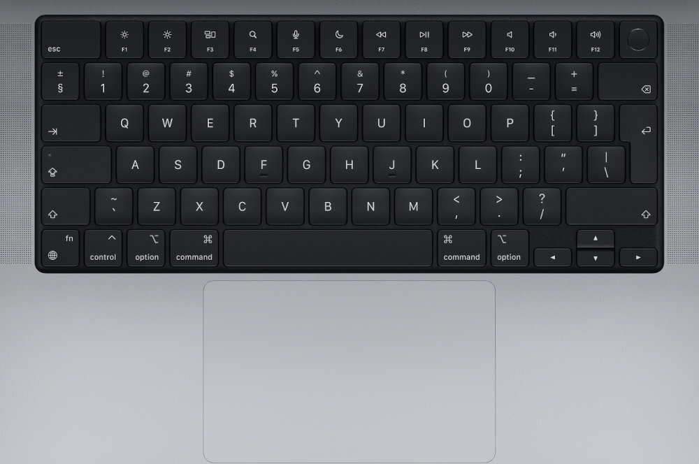 Czarna klawiatura laptopa z widocznymi klawiszami funkcyjnymi i literowymi. Poniżej znajduje się duży, srebrny touchpad.