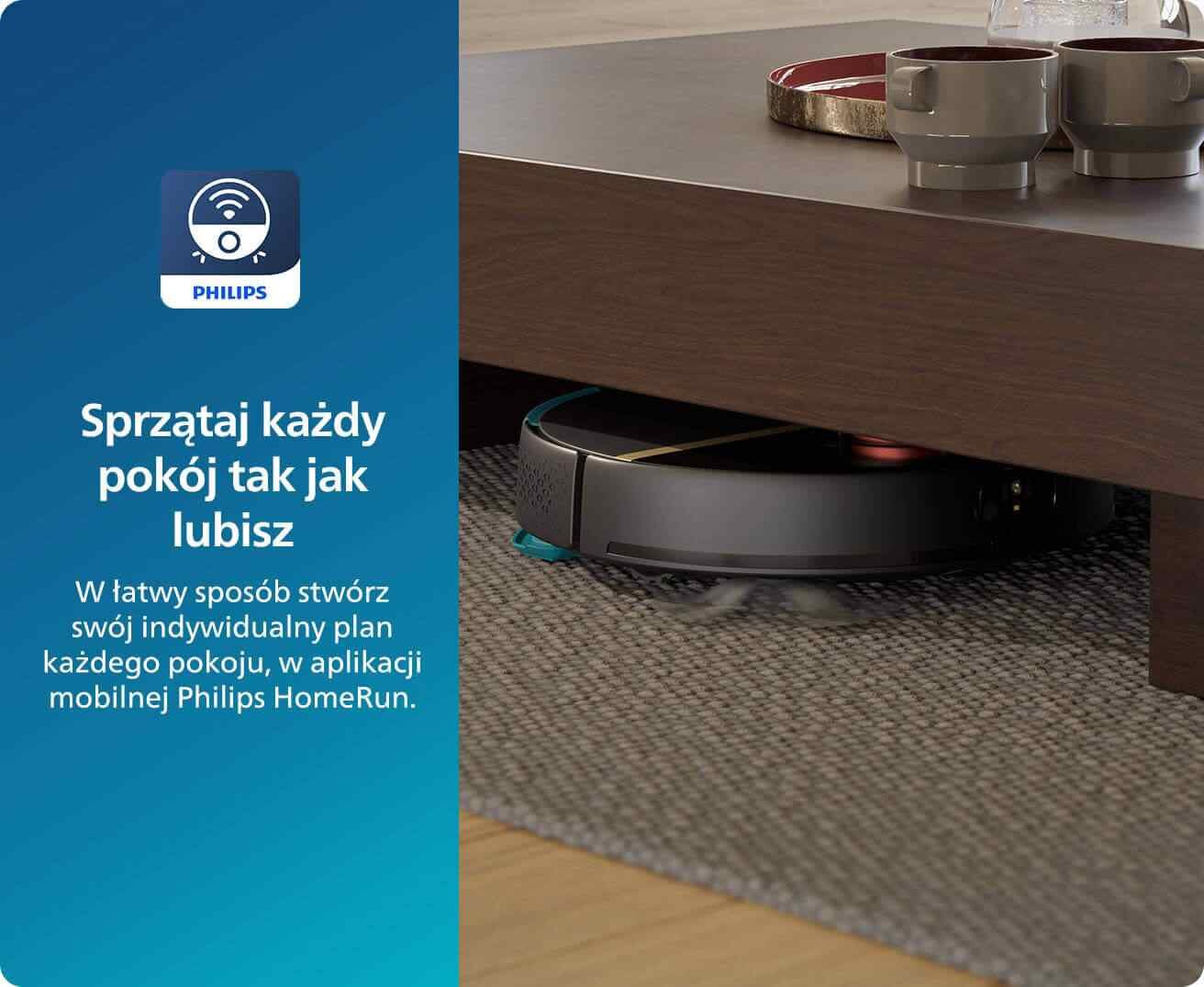 Robot sprzątający znajduje się pod niskim stolikiem na dywanie. Obok widoczny jest tekst: \'Sprzątaj każdy pokój tak jak lubisz. W łatwy sposób stwórz swój indywidualny plan każdego pokoju, w aplikacji mobilnej Philips HomeRun.\'