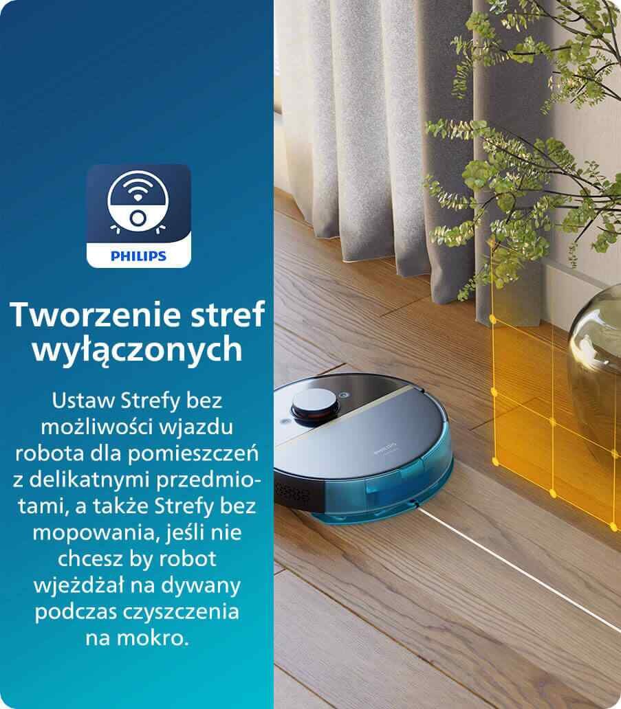 Obraz przedstawia robot sprzątający na drewnianej podłodze obok zasłony i rośliny. Po lewej stronie znajduje się niebieski panel z logo PHILIPS i tekstem: \'Tworzenie stref wyłączonych Ustaw Strefy bez możliwości wjazdu robota dla pomieszczeń z delikatnymi przedmiotami, a także Strefy bez mopowania, jeśli nie chcesz by robot wjeżdżał na dywany podczas czyszczenia na mokro.\'