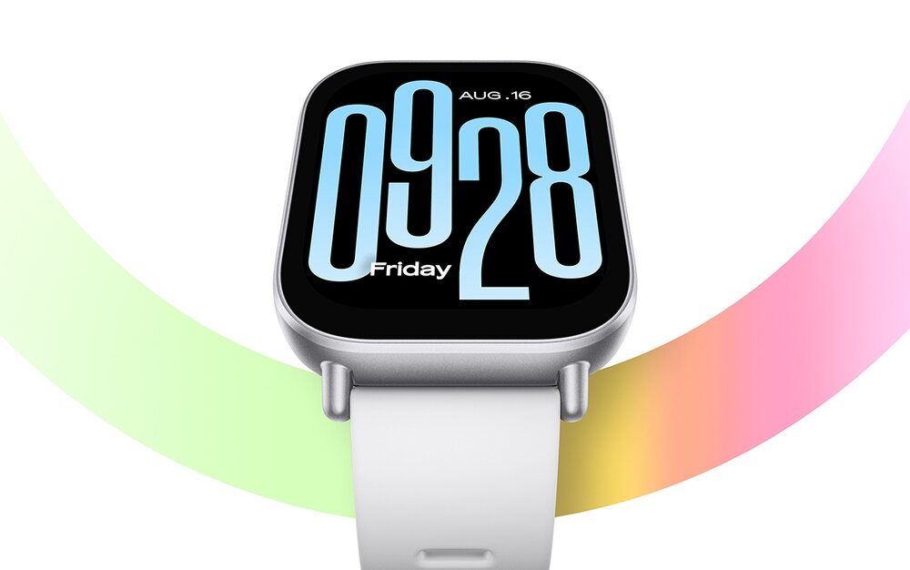Smartwatch z białym paskiem i dużym wyświetlaczem, na którym widoczna jest godzina 09:28, dzień tygodnia \'Friday\' oraz data \'AUG. 16\'. W tle kolorowe, łukowate pasy w odcieniach zieleni, różu i żółci.