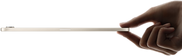 Na obrazie widoczny jest cienki tablet trzymany w dłoni, ukazany z profilu. Urządzenie ma jasną obudowę i zaokrąglone krawędzie.