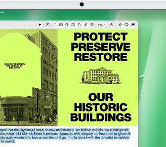 Na ekranie komputera widoczny jest dokument z tekstem: \'PROTECT PRESERVE RESTORE OUR HISTORIC BUILDINGS\'. Obok znajduje się ilustracja budynku oraz fragment tekstu w języku angielskim.