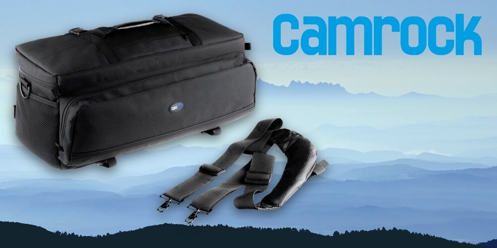 Czarna torba Camrock Tank X65 z odpinanym paskiem na ramię, ustawiona na tle gór i logo Camrock w prawym górnym rogu.