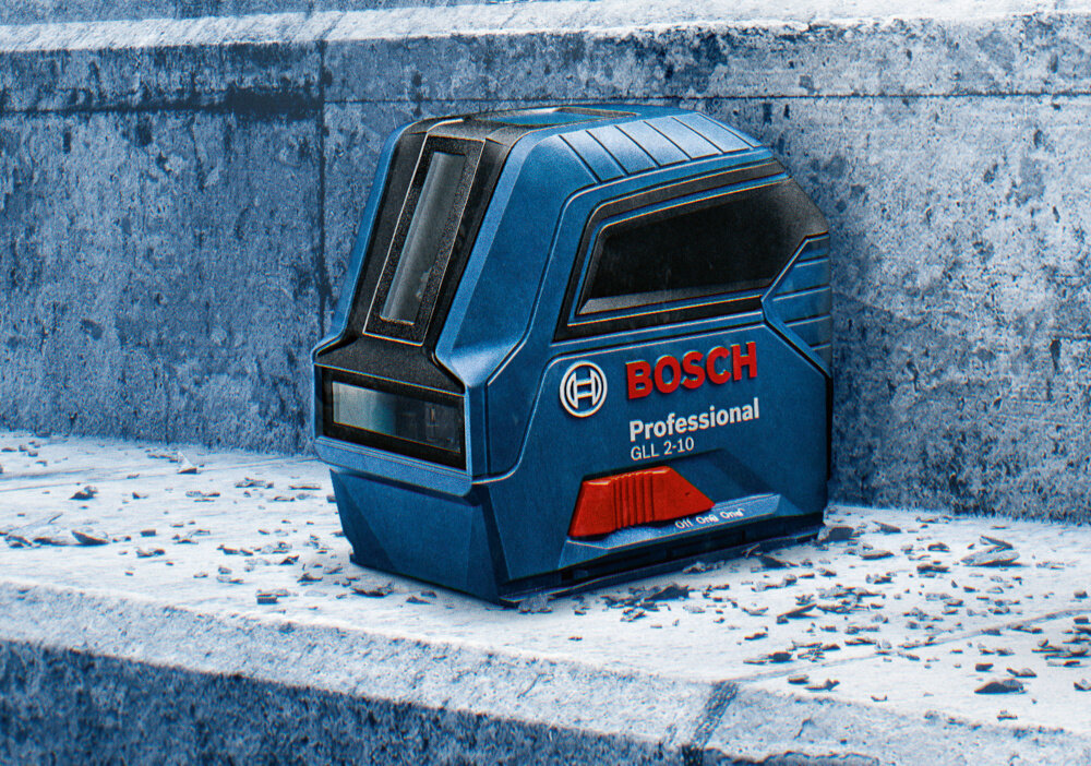 Laser liniowy BOSCH Professional GLL 2-10 0601063L00 schody szare na schodach ustawiony laser działa w temperaturach od -10°C do 50°C waga 0,49 kg łatwe do przenoszenia i wygodne w obsłudze