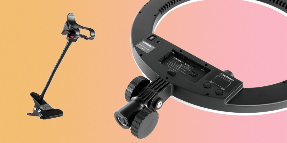 Lampa pierścieniowa LED Yongnuo YN408 z widocznym mocowaniem przeguowym oraz uchwyt na urządzenia mobilne