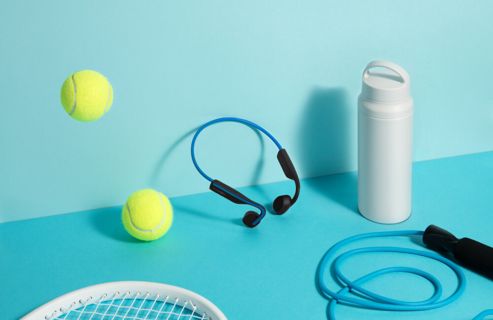 SŁUCHAWKI BLUETOOTH AFTERSHOKZ OPENMOVE KOSTNE NIEBIESKIE wbudowany mikrofon trieningi muzyka sportowcy