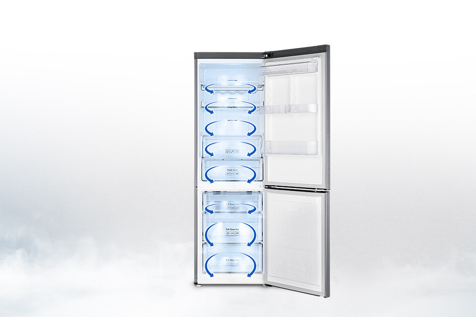 Otwarta na oścież, pusta lodówka z oznaczonym strzałkami kierunkiem przepływu powietrza