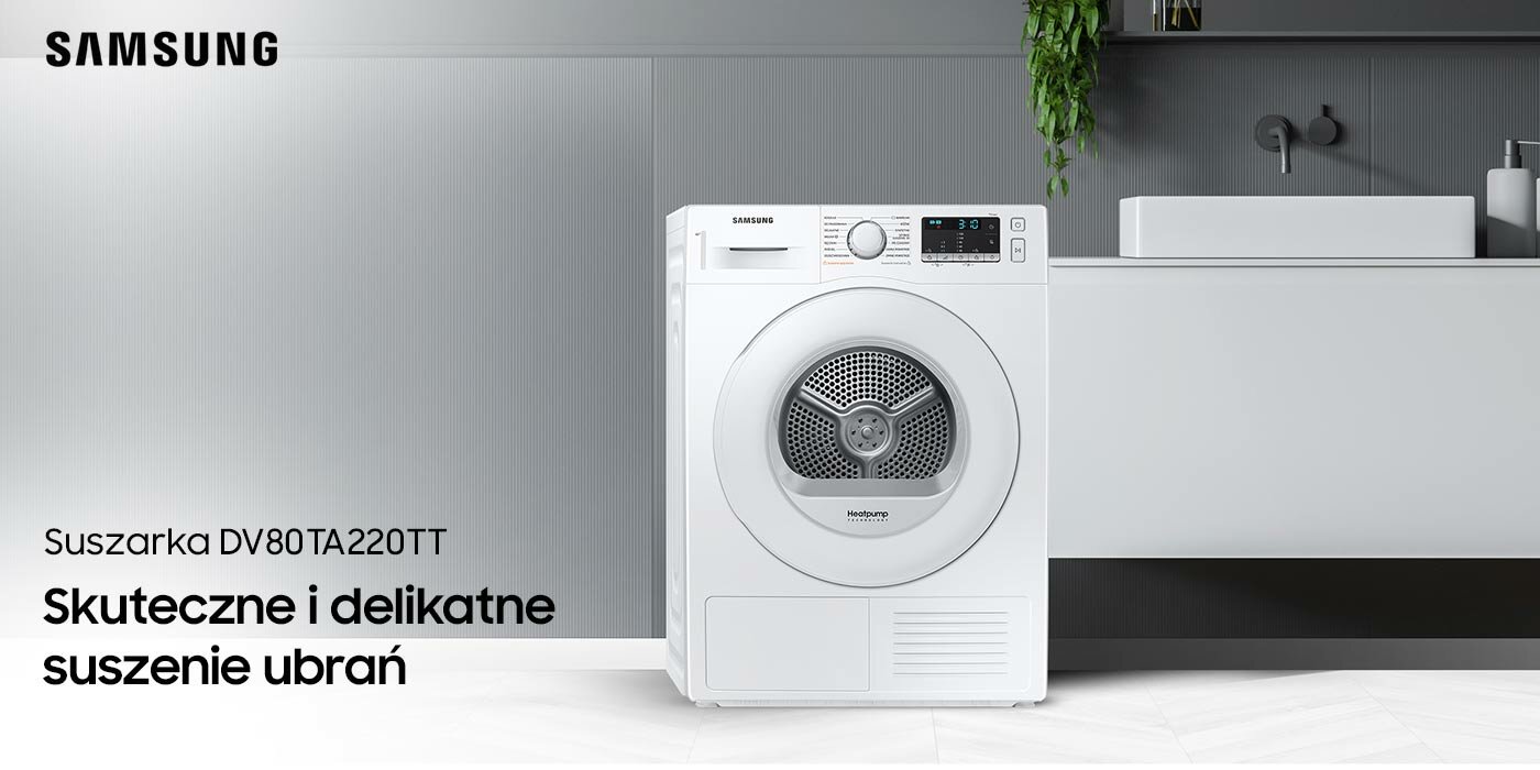 Suszarka znajduje się w łazience a obok niej jest biała wisząca szafka  Suszarka znajduje się w łazience a obok niej jest biała wisząca szafka