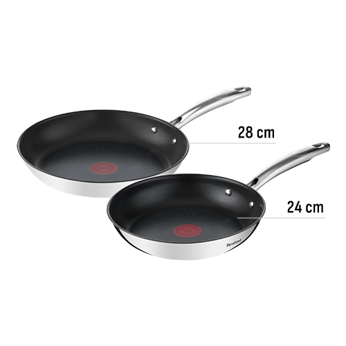 Dwie stalowe patelnie z czarnym wnętrzem i czerwonym wskaźnikiem temperatury na środku. Obie mają srebrne uchwyty i są oznaczone logo TEFAL.