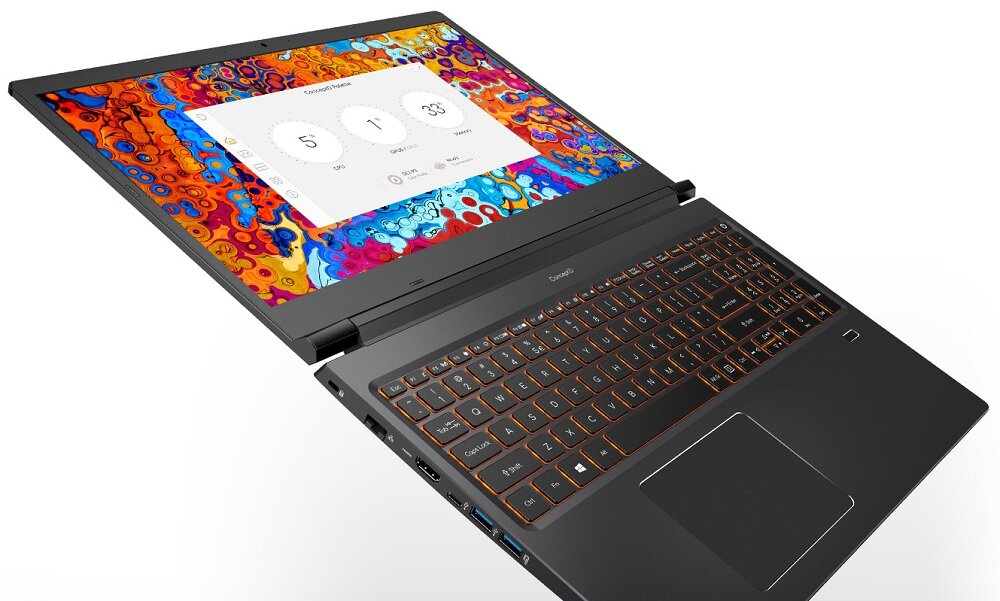Laptop z otwartym ekranem, na którym widoczny jest kolorowy wzór i interfejs z trzema okrągłymi ikonami. Klawiatura jest podświetlana na pomarańczowo, a obudowa ma ciemny kolor.