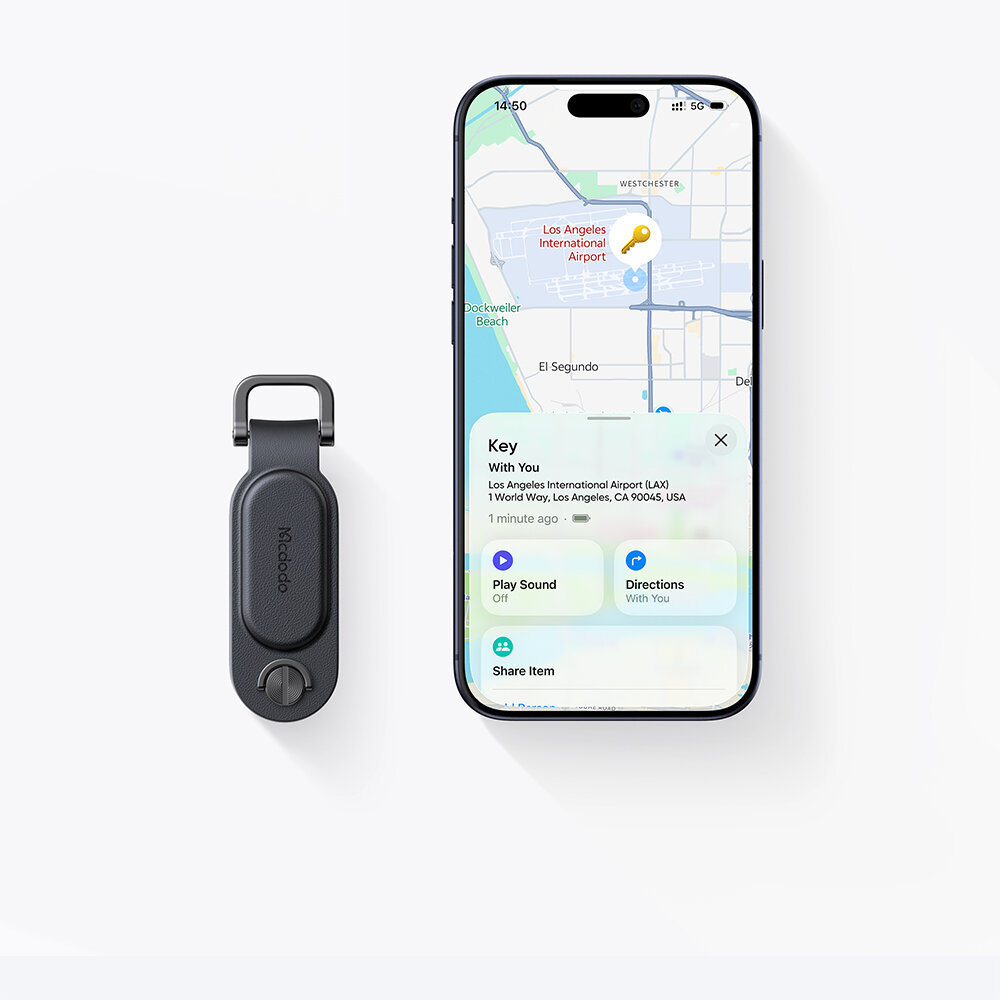Na obrazie widoczny jest czarny lokalizator kluczy z logo \'Mcdodo\' oraz smartfon z mapą i informacją o lokalizacji \'Los Angeles International Airport\'.