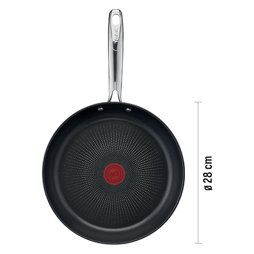Na obrazie widoczna jest patelnia z czarną powłoką wewnętrzną i metalowym uchwytem. Na środku patelni znajduje się czerwony okrągły wskaźnik z logo TEFAL.