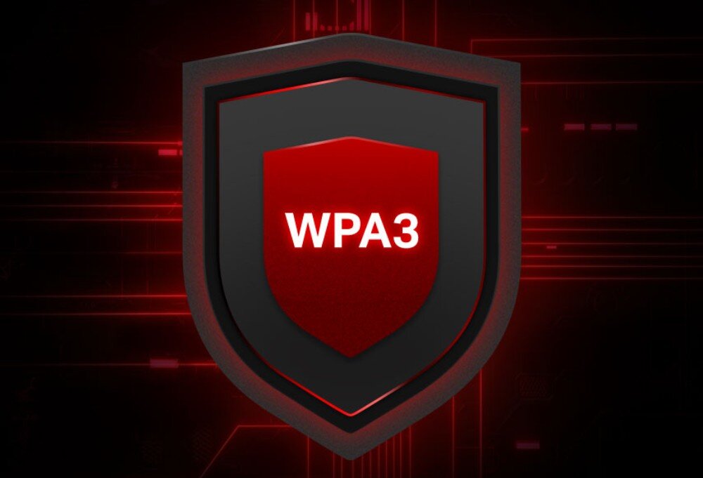 Router MERCUSYS MR70X Ciemna tarcza z czerwonym obrysem i białym napisem WPA3 symbolizująca zabezpieczenia sieciowe , szyfrowanie, bezpieczeństwo