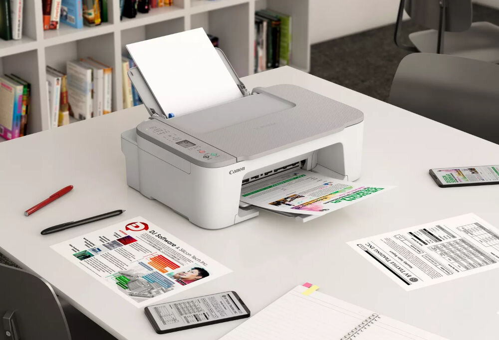 Urządzenie wielofunkcyjne CANON TS3451 Druk w kolorze, Wi-Fi  prezentacja urządzenia na biurku w biurze wśród dokumentów