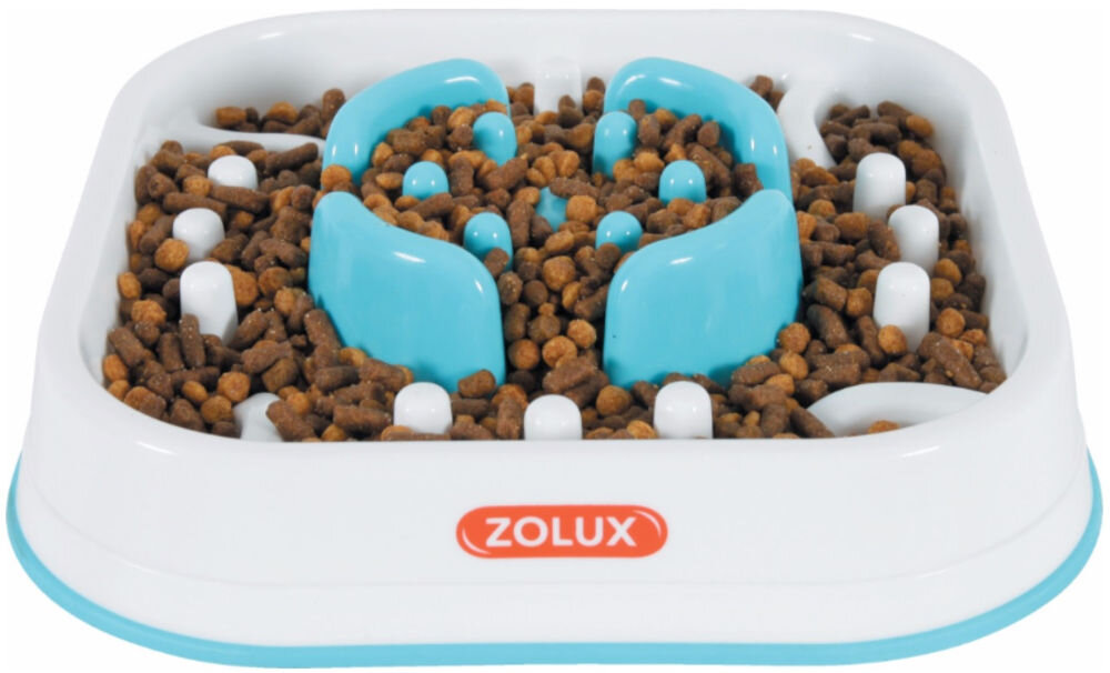 Miska spowalniająca dla psa i kota ZOLUX 474144 Biała miska spowalniająca z niebieskimi elementami, posiada logo ZOLUX na czerwonym tle. Miska ma nieregularny kształt z wypustkami, które utrudniają szybkie jedzenie