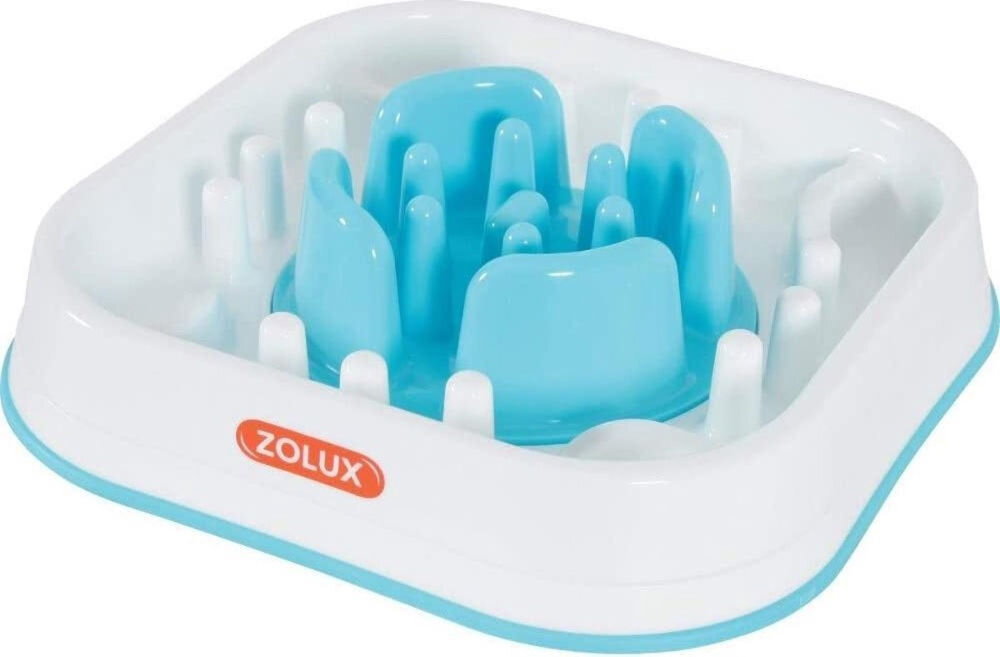 Miska spowalniająca dla psa i kota ZOLUX 474144 Biała miska spowalniająca dla zwierząt w kształcie kości z niebieskimi elementami i logo ZOLUX na boku. Miska posiada wypustki i zagłębienia, które utrudniają szybkie jedzenie