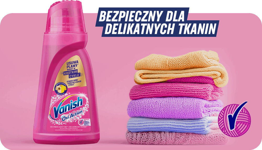 Odplamiacz do prania VANISH Oxi Action Różowy 1000 ml butelka płynu obok ręczników napis bezpieczny dla delikatnych tkanin