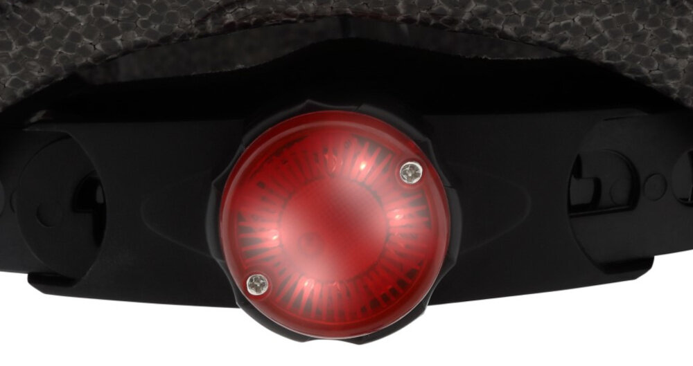 Kask HORNIT Unicorn Fioletowy dla Dzieci (rozmiar S) zbliżenie na lampkę wbudowana lampka z trzema trybami świecenia zwiększa widoczność dziecka porosty system obsługi wystarczy przycisnąć lampkę jedno to tryb migający dwa to tryb pulsacyjny trzy to światło ciągłe czwarte naciśnięcie wyłącza światło