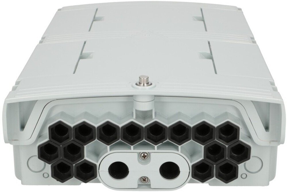 Puszka połączeniowa EXTRALINK EX.15968 Zbliżenie na dolny panel obudowy z licznymi czarnymi otworami o sześciokątnym kształcie oraz środkowym elementem z dwoma okrągłymi wejściami