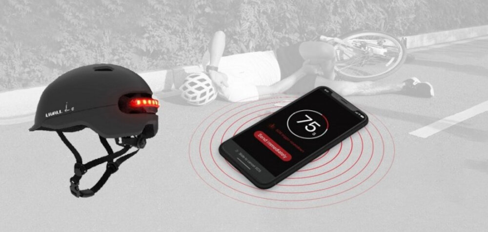 Kask LIVALL C20 Czarny (rozmiar L) szare tło kask widoczny od tyłu pod skosem obok telefon w tle leży osoba na drodze zaawansowany detektor upadku bezpłatna aplikacja Livall Riding jeśli po wypadku kask pozostaje w bezruchu przez 10 sekund uruchamia 90-sekundowe odliczanie wysłanie Alertu SOS do wskazanego kontaktu przybliżoną lokalizacją GPS telefonu na systemy Android i iOS
