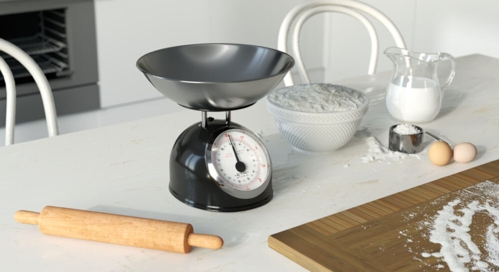 Waga kuchenna ETA Storio 577790020 czarna waga stoi na blacie srebrna miska duży panel wskaźnik obok rozsypana mąka wałek trwałość funkcjonalność mechaniczna konstrukcja wydajność wytrzymała w całości metalowa obudowa trwałość antypoślizgowe nóżki bezpieczne i komfortowe użytkowanie 