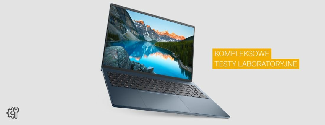 Laptop z otwartym ekranem, na którym widoczny jest krajobraz z górami i jeziorem. Obok znajduje się napis \'KOMPLEKSOWE TESTY LABORATORYJNE\'.