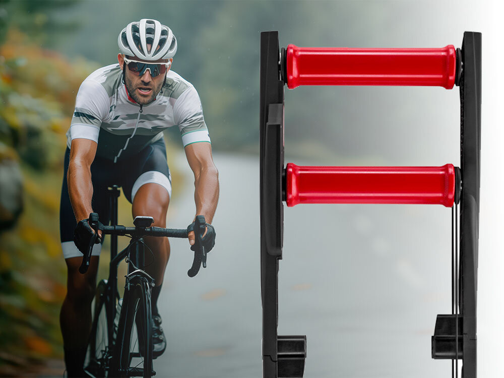 Trenażer rowerowy ELITE Arion Mag osoba jedzie na rowerze obok złożony trenażer widziany od przodu możesz odczuwać realistyczne wrażenia z jazdy magnetyczny opór o maksymalnej mocy 520 W dostosowanie intensywności treningu do indywidualnych potrzeb stabilna konstrukcja z ośmioma punktami podparcia komfort bezpieczeństwo