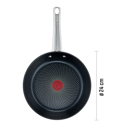 Na obrazie widoczna jest czarna patelnia z metalicznym uchwytem i czerwonym okrągłym wzorem na środku dna. Na uchwycie znajduje się logo \'Tefal\'.