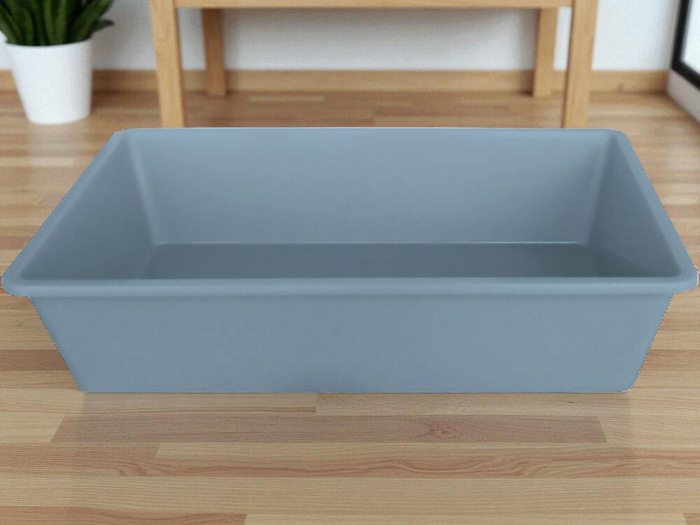 Kuweta dla kota ZOLUX 96663 Niebieski postawiona na podłodze w domu w tle meble rośliny