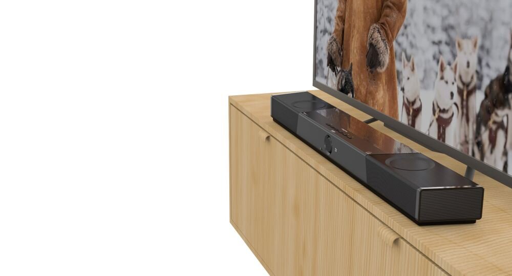 Soundbar komputerowy CREATIVE SXFI Carrier algorytm poprawy dialogów separacja dźwięku film, soundbar pod skosem stojacy na komodzie obok telewizora