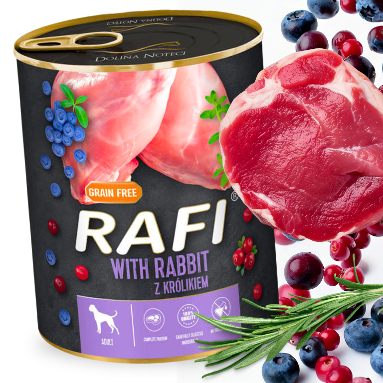 Puszka mokrej karmy dla psa marki RAFI z królikiem, ozdobiona grafiką mięsa i owoców. Na etykiecie widnieje napis \'GRAIN FREE\' oraz \'WITH RABBIT Z KRÓLIKIEM\'.
