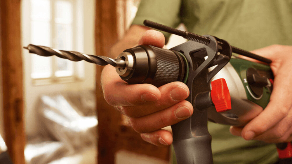 Wiertarka udarowa BOSCH EasyImpact 570 kluczykowy uchwyt wiertarski system Autolock automatycznie blokuje wrzeciono wiertarki