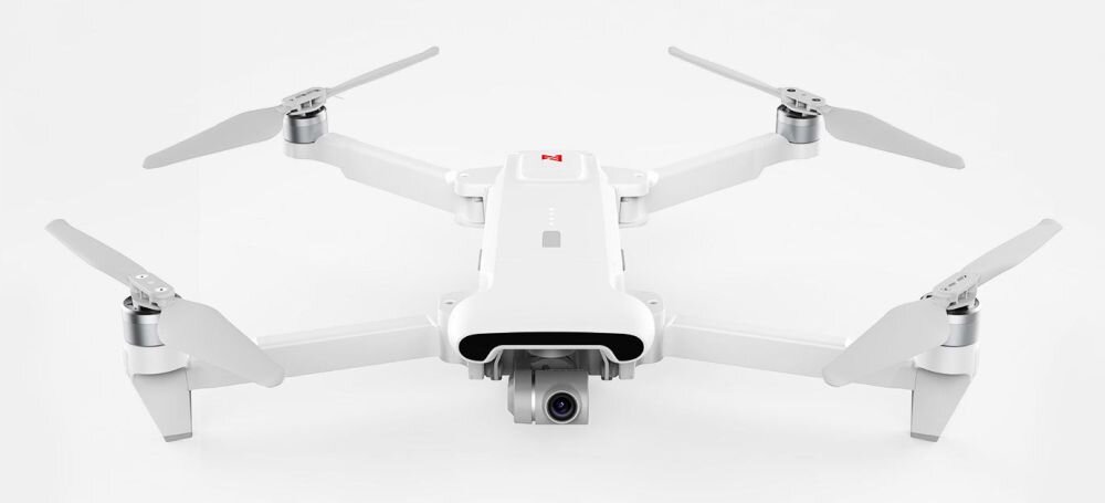 Dron FIMI X8 SE 2022 bateria lot sterowanie akrobacje czas lotu zasięg funkcje lądowanie kamera rozdzielczość filmy zdjęcia nagrywanie jakość ładowanie aplikacja przesył pilot śmigła stabilizacja fotografia waga wymiary konstrukcja obudowa korpus ramiona silnik