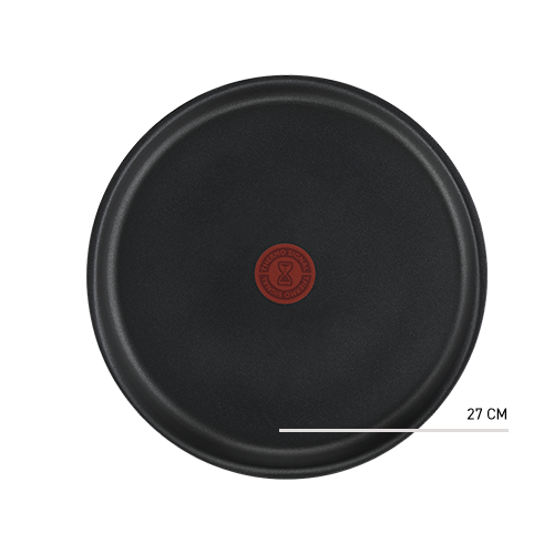 Czarna patelnia z czerwonym okrągłym wskaźnikiem temperatury na środku. Na wskaźniku widoczny jest symbol klepsydry i napis \'THERMO-SPOT\'.