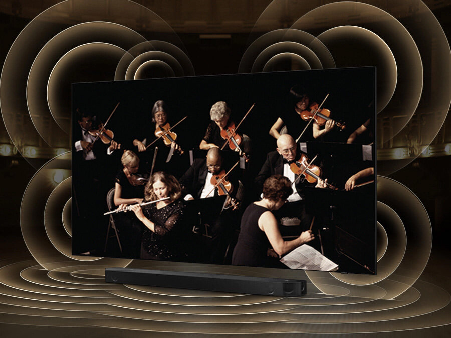 phpcr5ug7 pl-feature-tv-and-soundbar-orchestrated-in-perfect-harmony-531081710 Symulacja rozchodzenia się fal dźwiękowych z telewizora i soundbara grających równomiernie dzięki technologii Q Symphony.