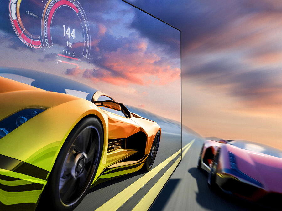 phpkneco6 pl-feature-exceptional-gaming-experience-with-4k-144hz-531081708 2 samochody sportowe ścigają się na torze. 1 wygląda wyraźniej i jedzie szybciej. Wyświetlanie w 144 Hz.