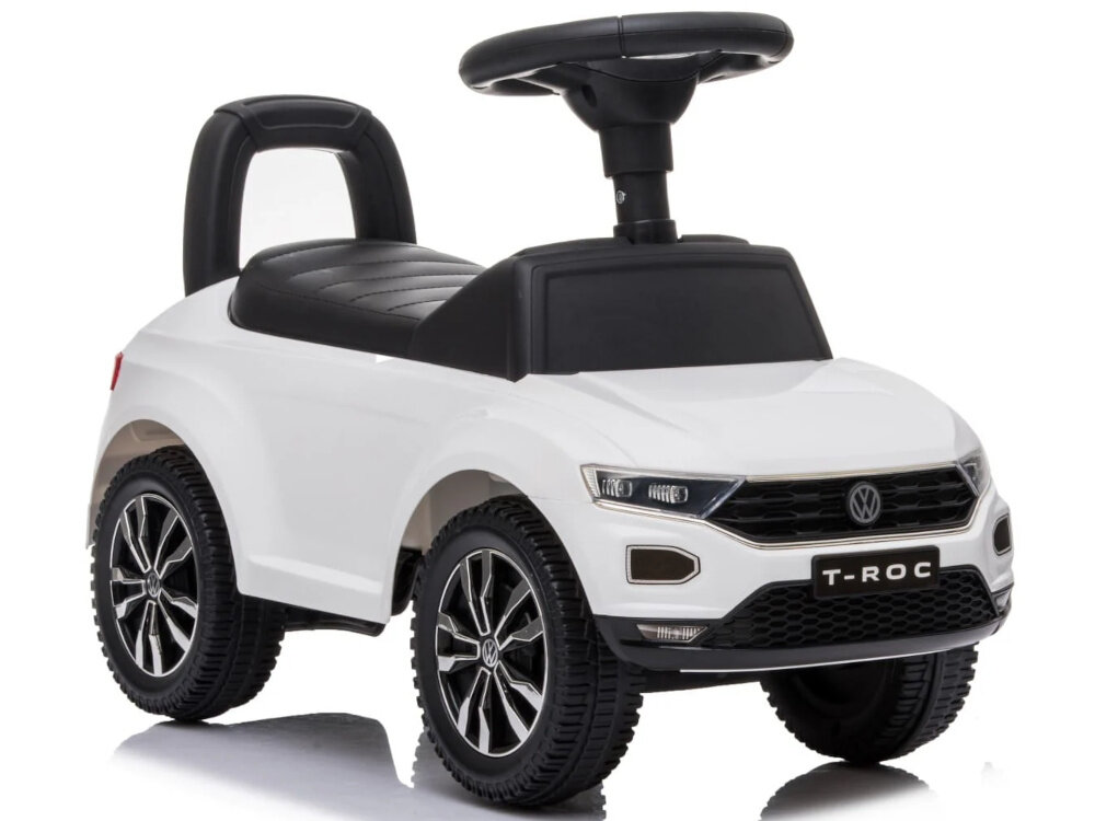Jeździk SUN BABY Volkswagen T-Roc Biały jeździk na białym tle widoczny od przodu pod skosem pierwsze pojazdowe wsparcie dla dzieci od 12. miesiąca życia bezpieczny pomaga rozwijać samodzielność stabilna konstrukcja wspiera naturalny rozwój ruchowy