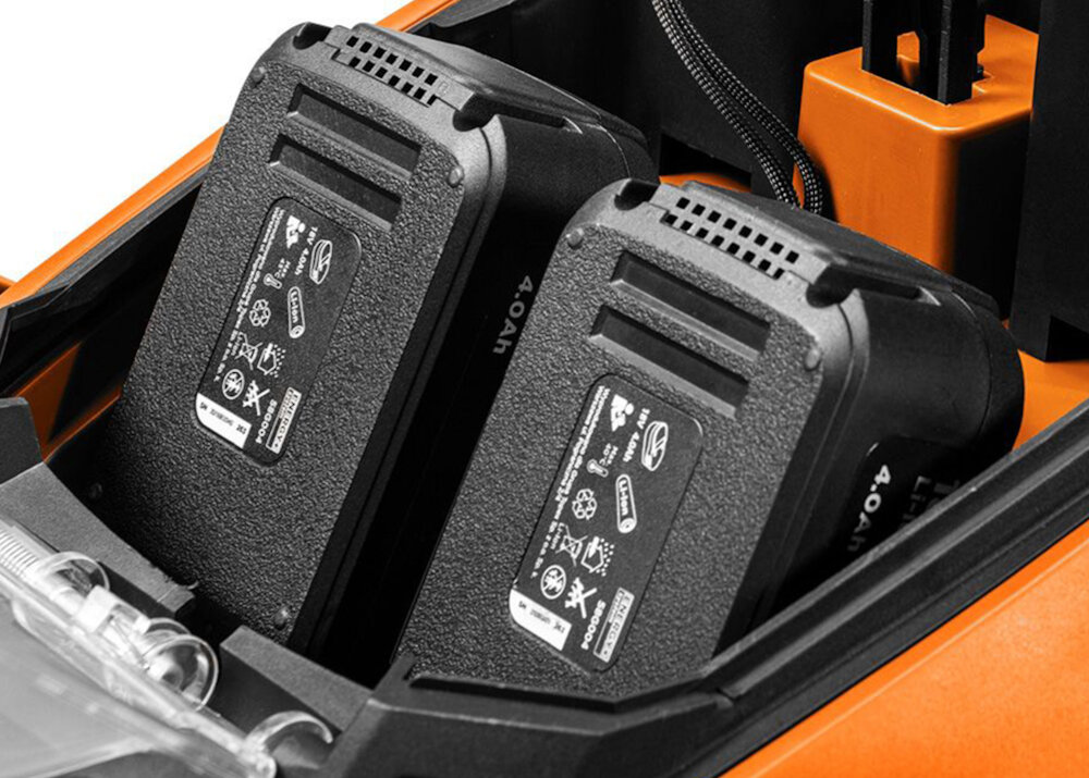 Kosiarka akumulatorowa NEO TOOLS 04-610 zasilanie silnik indukcyjny dwa akumulatory o napięciu 18 V każdy trwałość wytrzymałość duża moc wysoki moment obrotowy 2800 obr/min osłona na akumulatory model bez akumulatorów i ładowarki