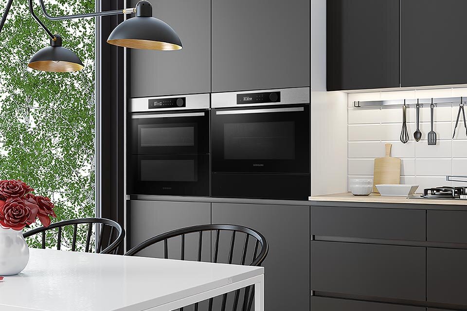 Zdjęcie pokazuje zabudowę kuchenną w której znajduje się piekarnik Samsung Dual Cook Flex™, uzupełniony o piekarnik kompaktowy NQ5B5763DBS oraz szufladę podgrzewającą Zdjęcie pokazuje zabudowę kuchenną w której znajduje się piekarnik Samsung Dual Cook Flex™, uzupełniony o piekarnik kompaktowy NQ5B5763DBS oraz szufladę podgrzewającą