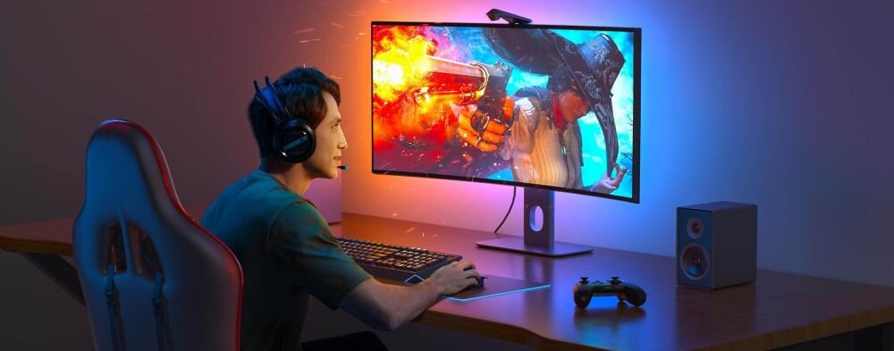 Taśma LED GOVEE H604B 1.4 m Wi-Fi/Bluetooth, gaming, RGBIC, kamera, synchronizacja, dziecko gra na komputerze z zamontowaną taśmą led govee za monitorem