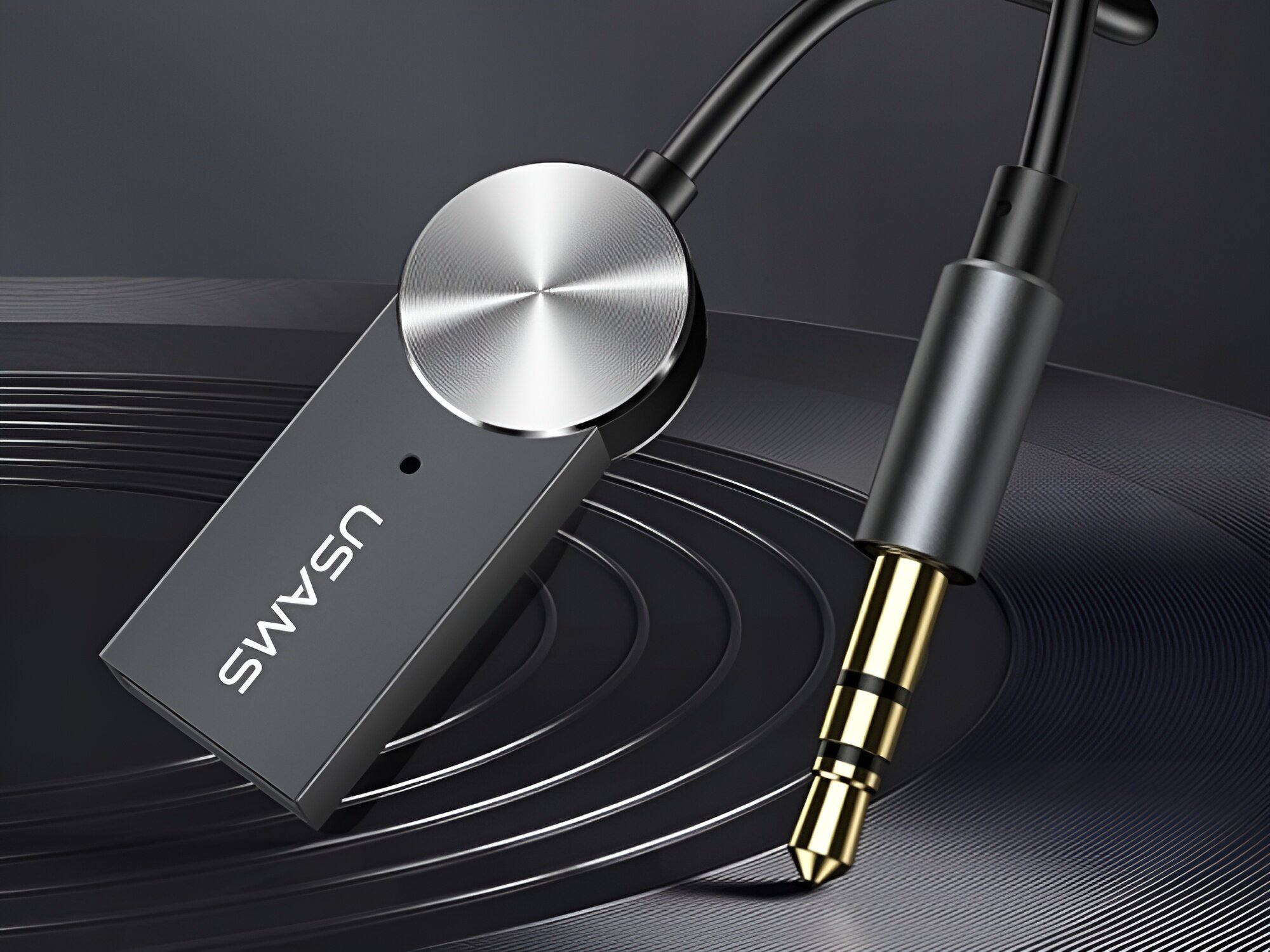 Adapter audio USAMS US-SJ464 Bluetooth
            adapter na ciemnym tle audio bluetooth