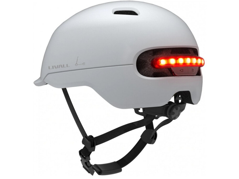 Kask LIVALL C20 Biały (rozmiar M) kask na białym tle widoczny od tyłu pod skosem zintegrowane oświetlenie LED trzy tryby pracy tryb adaptacyjny jedna centralna dioda 7 diod tryb sekwencyjny z szybkim, podwójnym błyskiem tryb progresywny, z rozświetlaniem od środka na zewnątrz zmniejsza ryzyko kolizji