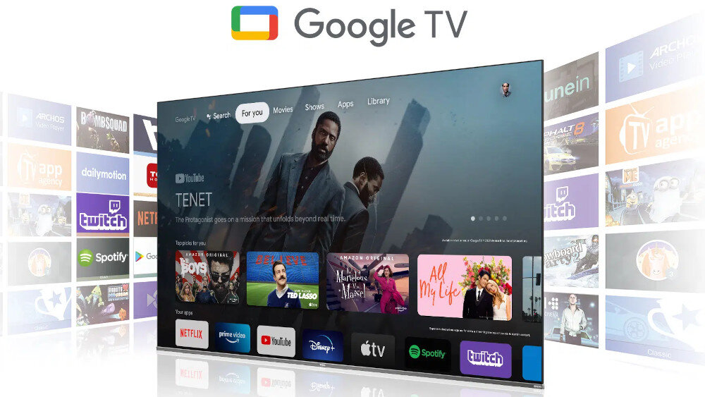 Telewizor wyświetla interfejs Google TV z różnymi aplikacjami, takimi jak YouTube, Netflix, Apple TV i Twitch. Na ekranie widoczny jest film \'TENET\' oraz logo Google TV u góry.